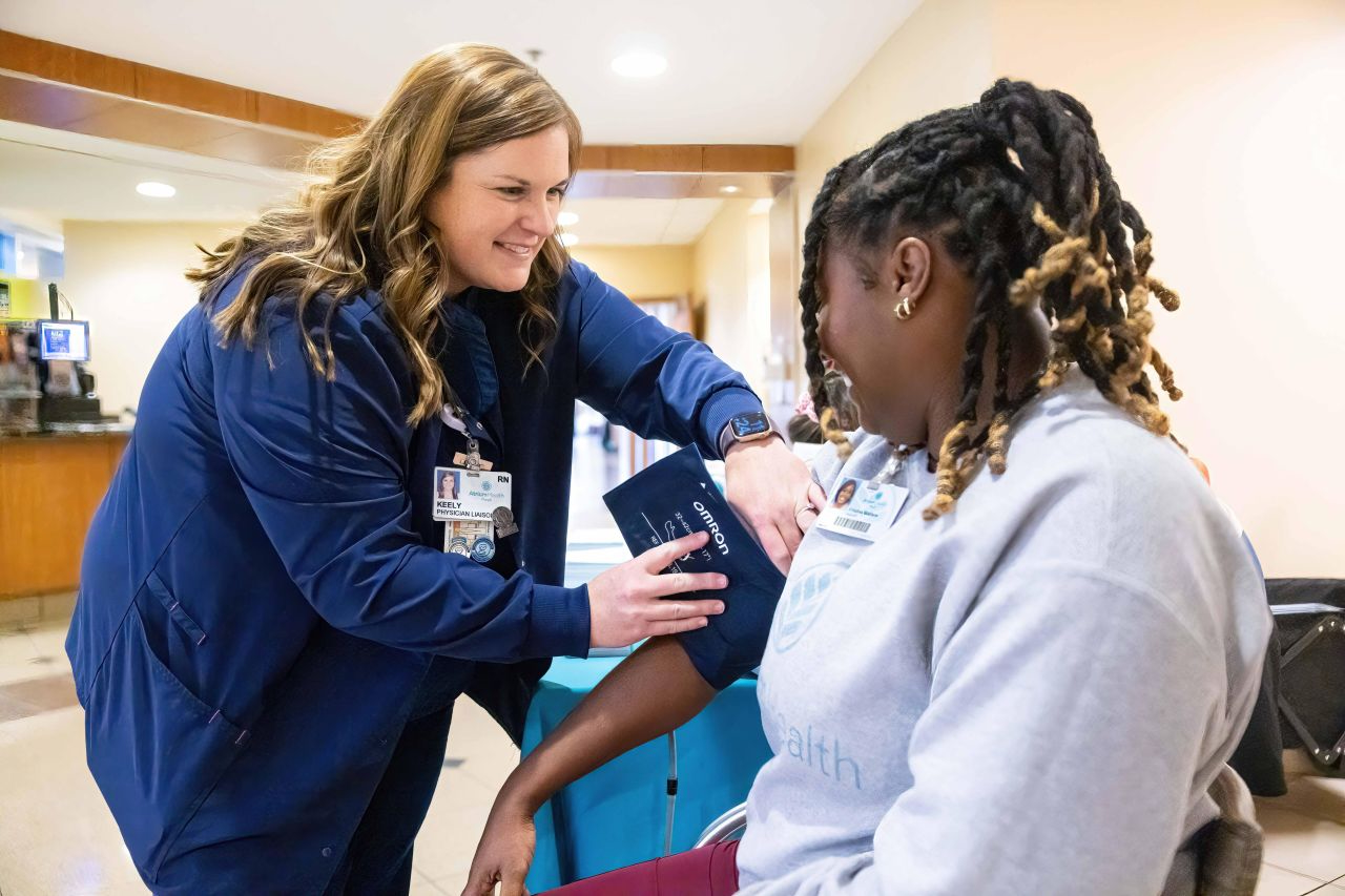 Nurse taking patient's blood pressure